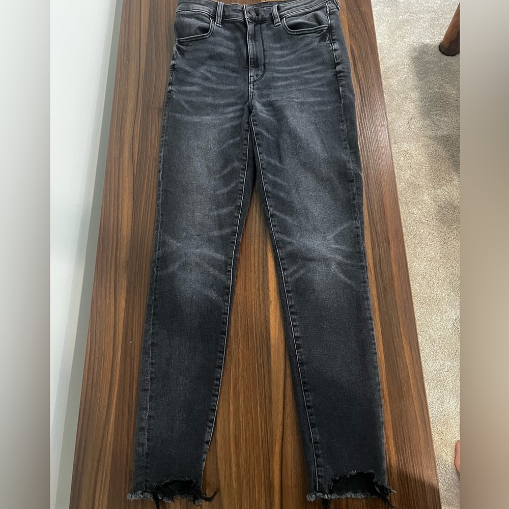 Distressed charcoal jeans